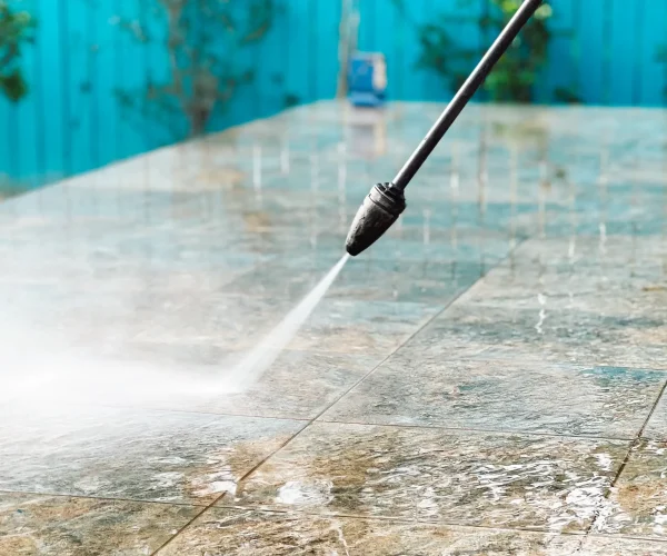 cleaning-patio-tiles-with-power-washer-2026-03-09-08-57-48-utc