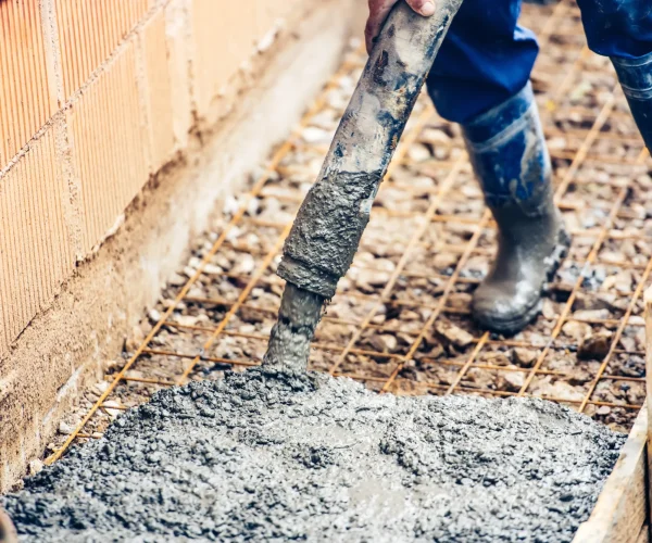 close-up-of-industrial-worker-pouring-cement-or-co-2026-01-05-01-03-03-utc