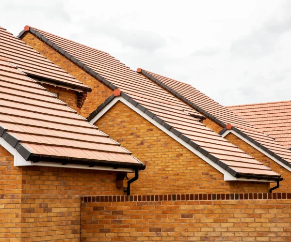 exterior-view-of-yellow-brick-row-house-with-yello-2026-03-25-00-51-36-utc