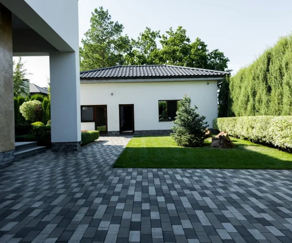 facade-of-new-modern-house-with-empty-parking-and-2026-03-12-22-48-19-utc